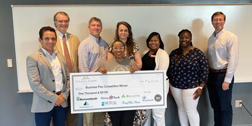 Spring 2021 Entrepreneur Boot Camp Winner with check