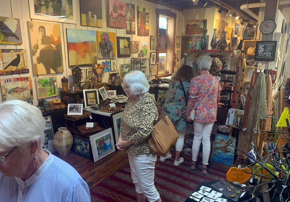 The Attic Gallery people shopping at antique store