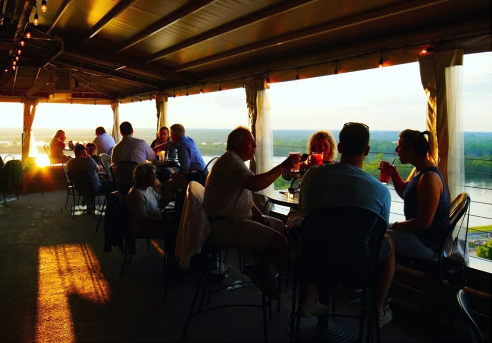 Sunset view people sharing drinks at sunset meet up