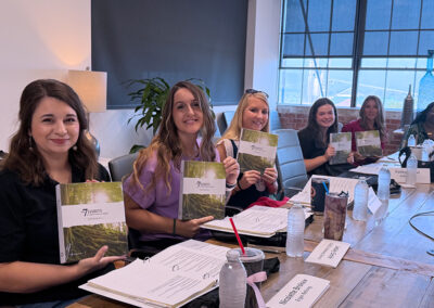 class of students holding books