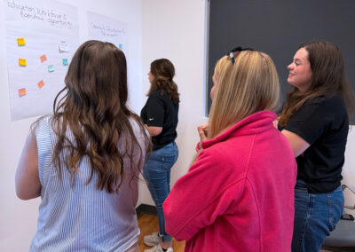 students examining board